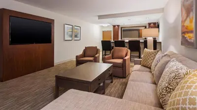 a living room with a couch and a flat screen tv at Holiday Inn Express & Suites Medina by IHG in Medina