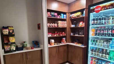 a store with a refrigerator and shelves with drinks at Holiday Inn Express Lordstown-Newton Falls/Warren by IHG in Newton Falls
