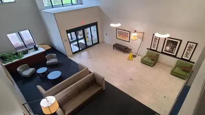 an overhead view of a living room with a couch and chairs at Holiday Inn Express Lordstown-Newton Falls/Warren by IHG in Newton Falls