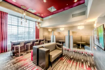 a restaurant with chairs and tables in a room at Staybridge Suites - University Area OSU by IHG in Columbus