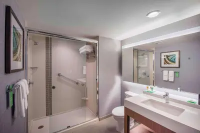 a bathroom with a shower and a sink and a toilet at Hyatt Place Cleveland/Westlake/Crocker Park in Westlake