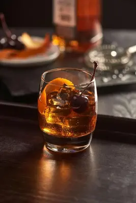 a glass of alcohol with a drink and fruit at Hyatt Place Cleveland/Westlake/Crocker Park in Westlake