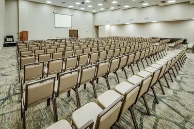 an empty lecture hall with chairs and a screen at DoubleTree by Hilton Huntington, WV in Huntington