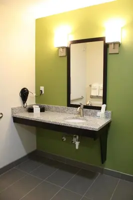 a bathroom with a sink and a mirror at Sleep Inn Ellenboro Hwy 50 in Ellenboro