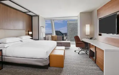 a hotel room with a bed and a television at Hilton Cleveland Downtown in Cleveland
