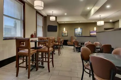 a restaurant with tables and chairs in a room at Drury Plaza Hotel Cleveland Downtown in Cleveland