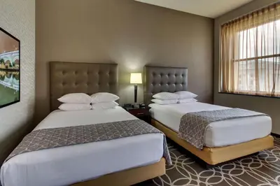 a hotel room with two beds and a window at Drury Plaza Hotel Cleveland Downtown in Cleveland