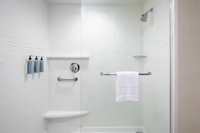 a bathroom with a shower with a glass door at Residence Inn by Marriott Wheeling/St. Clairsville in Saint Clairsville