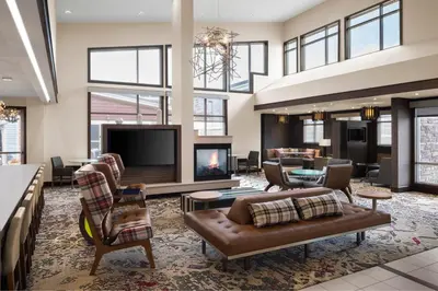 a living room with a couch and a tv at Residence Inn by Marriott Wheeling/St. Clairsville in Saint Clairsville