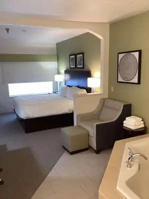 a hotel room with a bed and a sink at Best Western Celina in Celina