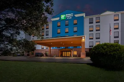 a hotel with the front of the building at night at Holiday Inn Express Hotel & Suites Charleston-Southridge by IHG in Charleston