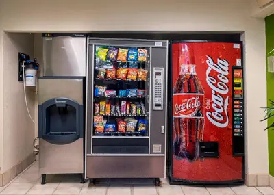 a cocacola soda vending machine next to a coke machine at Red Roof Inn Cleveland - Medina in Medina