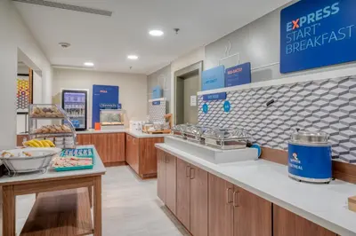 a grocery store with a counter with food items at Holiday Inn Express Hotel & Suites Greenville by IHG in Greenville