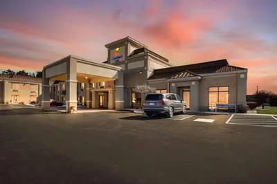 a car parked in a parking lot in front of a hotel at Comfort Inn Huntington Near University in Huntington