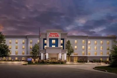 an office building with a sign on the front of it at Hampton Inn & Suites Canton in North Canton