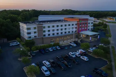 an aerial view of a building with cars parked in a parking lot at Holiday Inn Express Georgetown by IHG in Georgetown