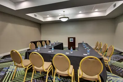a conference room with a long table and chairs at Holiday Inn Express Georgetown by IHG in Georgetown