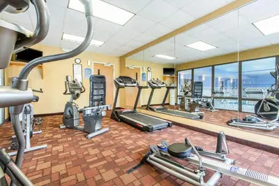 a gym with treadmills and elliptical machines at Quality Inn & Suites Lawrenceburg in Lawrenceburg