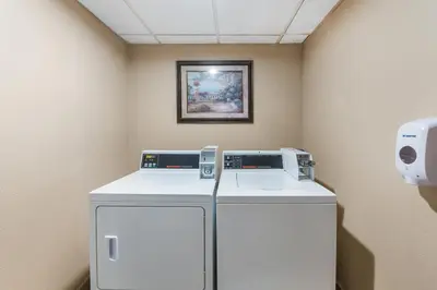 a washer and dryer in a room at Holiday Inn Express London-I-70 by IHG in London