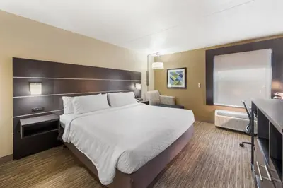 a hotel room with a large bed and a window at Holiday Inn Express London-I-70 by IHG in London