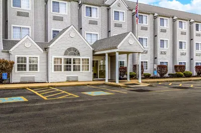 a large building with a parking lot in front of it at Quality Inn & Suites North Lima - Boardman in North Lima