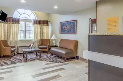 a waiting room at a hospital with chairs and a tv at Quality Inn & Suites North Lima - Boardman in North Lima
