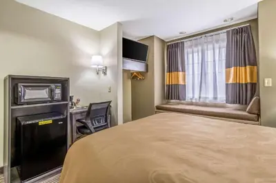 a hotel room with a bed and a window at Quality Inn & Suites North Lima - Boardman in North Lima
