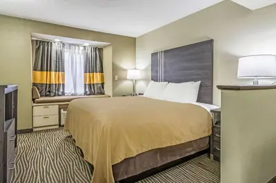 a hotel room with a large bed and a window at Quality Inn & Suites North Lima - Boardman in North Lima