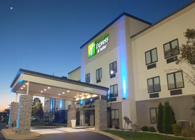 a hotel with a sign on the front of it at Holiday Inn Express Hotel & Suites Madison by IHG in Madison