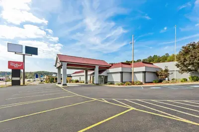 an empty parking lot in front of a gas station at Red Roof Inn Cambridge, OH in Cambridge