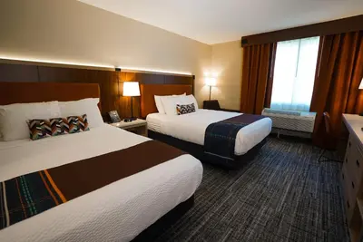 a hotel room with two beds and a window at Sawmill Creek by Cedar Point Resorts in Sandusky