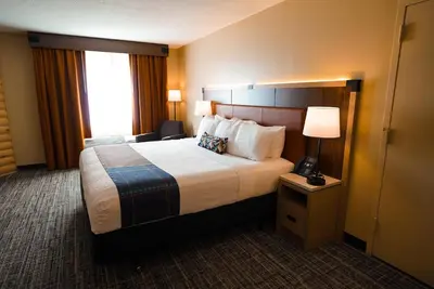 a hotel room with a large bed and a window at Sawmill Creek by Cedar Point Resorts in Sandusky