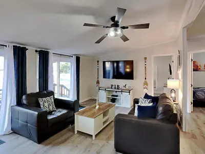 a living room with two couches and a ceiling fan at Put-in-Bay Island Club #5 in Put-in-Bay