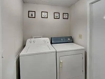 a white washer and dryer in a small room at Put-in-Bay Island Club #13 in Put-in-Bay