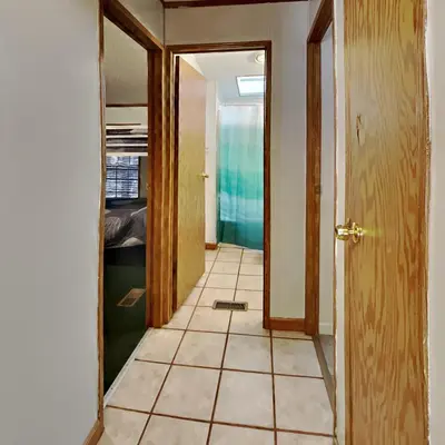 a hallway with a door and a tiled floor at Put-in-Bay Island Club #51 in Put-in-Bay