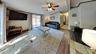 a living room with a couch and a ceiling fan at Put-in-Bay Island Club #51 in Put-in-Bay