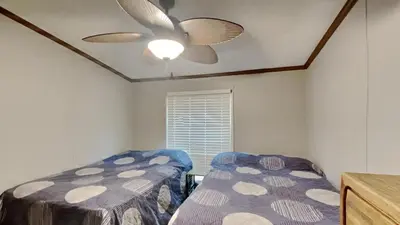 a bedroom with two beds and a ceiling fan at Put-in-Bay Island Club #71 in Put-in-Bay