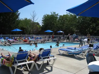 a group of people sitting in chairs in a swimming pool at Put-in-Bay Island Club #71 in Put-in-Bay