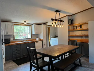 a kitchen with a table and chairs in a room at Put-in-Bay Island Club #71 in Put-in-Bay