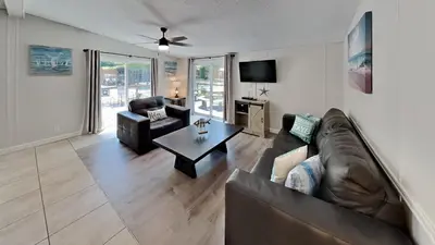 a living room with a couch and a table at Put-in-Bay Island Club #101 in Put-in-Bay