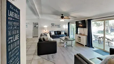 a living room with a couch and a table at Put-in-Bay Island Club #104 in Put-in-Bay