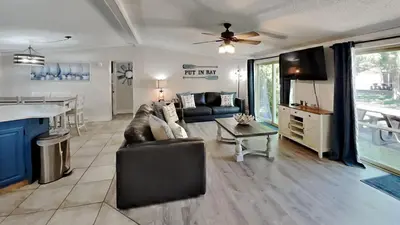 a living room with a couch and a table at Put-in-Bay Island Club #104 in Put-in-Bay