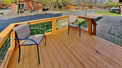 two chairs sitting on a wooden deck at Put-in-Bay Island Club #74 in Put-in-Bay