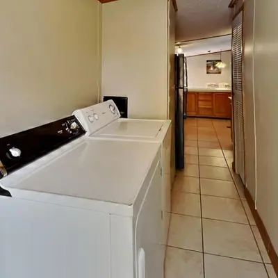 a kitchen with a white dishwasher in a room at Put-in-Bay Island Club #74 in Put-in-Bay