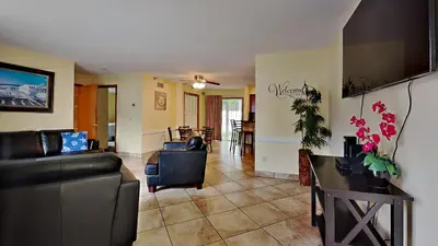 a living room with a couch and a table at Put-in-Bay Poolview Condo #4 in Put-in-Bay