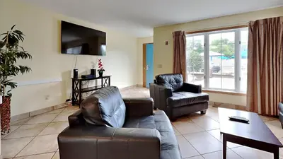 a living room with a couch and a chair at Put-in-Bay Poolview Condo #4 in Put-in-Bay
