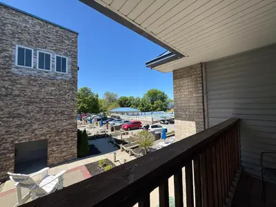 a balcony with a view of a parking lot at Put-in-Bay Poolview Condo #5 in Put-in-Bay
