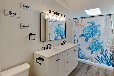 a bathroom with a sink and a shower curtain at Put-in-Bay Island Club #4 in Put-in-Bay