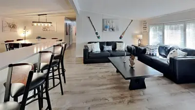 a living room with a couch and a table and a bar at Put-in-Bay Island Club #4 in Put-in-Bay