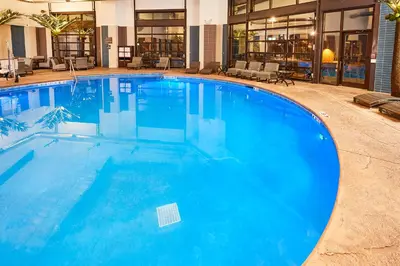 a large blue swimming pool in a hotel at LivINN Hotel Cincinnati North/ Sharonville in Sharonville